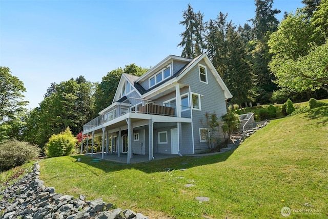 250 Fay Ln, Camano Island, WA 98282 - rear view of property featuring a lawn, a wooden deck, and a patio area