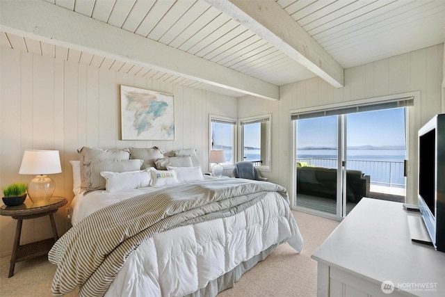 250 Fay Ln, Camano Island, WA 98282 - bedroom featuring wood walls, beamed ceiling, light colored carpet, and access to exterior