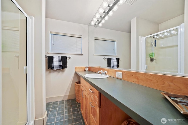 250 Fay Ln, Camano Island, WA 98282 - full bathroom featuring vanity, tile patterned floors, baseboards, visible vents, and a stall shower