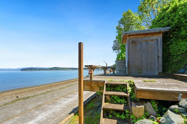 250 Fay Ln, Camano Island, WA 98282 - wooden terrace featuring a storage shed and a water view
