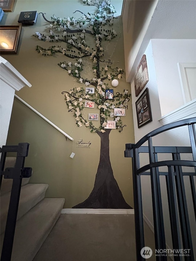 staircase featuring baseboards