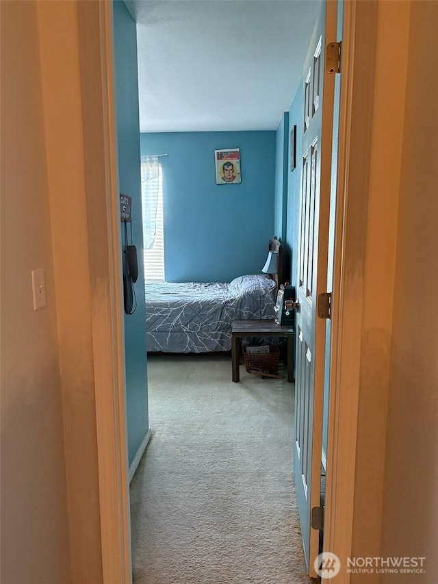 hall with carpet floors