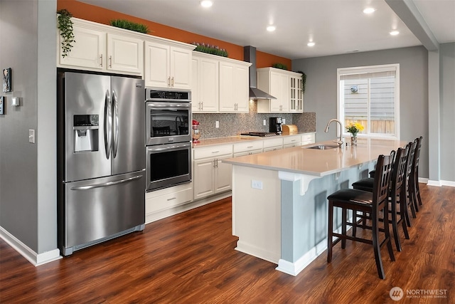 3908 187th Pl SE, Bothell, WA 98012 - kitchen with stainless steel appliances, a sink, dark wood-style floors, recessed lighting, and a kitchen island with sink