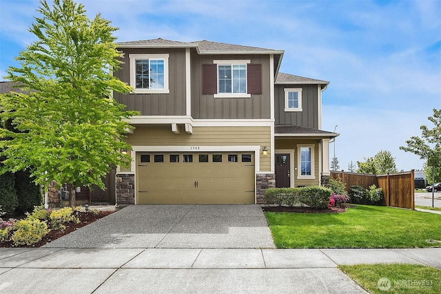 3908 187th Pl SE, Bothell, WA 98012 - view of front of house featuring stone siding, board and batten siding, driveway, and a garage