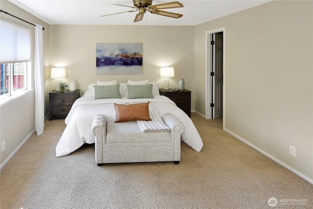 carpeted bedroom with baseboards and ceiling fan