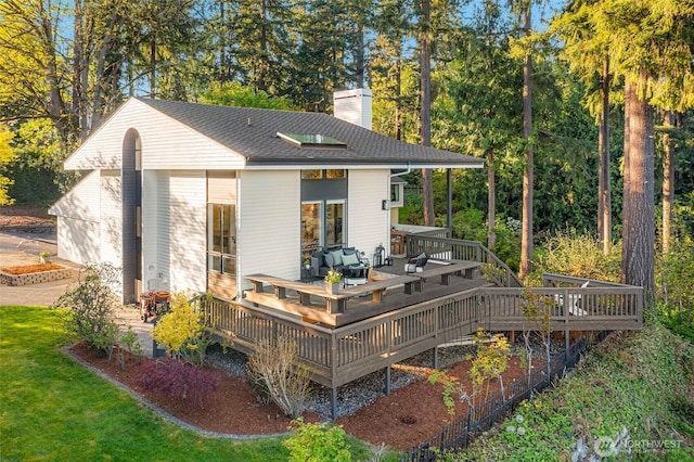 11324 83rd Pl NE, Kirkland, WA 98034 - rear view of property featuring a wooden deck, an outdoor hangout area, a chimney, and a yard