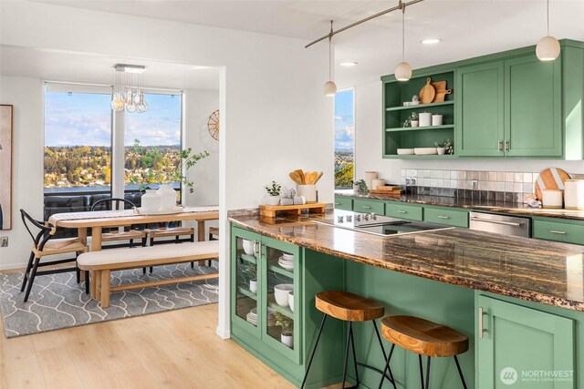 11324 83rd Pl NE, Kirkland, WA 98034 - kitchen with green cabinetry, open shelves, stainless steel dishwasher, light wood-style floors, and black electric stovetop