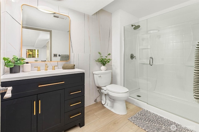 11324 83rd Pl NE, Kirkland, WA 98034 - bathroom with toilet, a stall shower, visible vents, wood finished floors, and vanity
