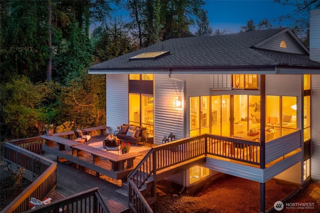 11324 83rd Pl NE, Kirkland, WA 98034 - back of property featuring roof with shingles, an outdoor living space with a fire pit, and a deck