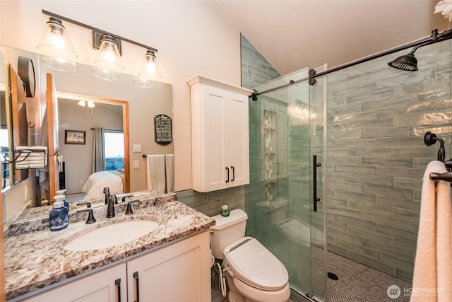 1573 Doe Run Rd, Sequim, WA 98382 - bathroom with toilet, vaulted ceiling, a shower stall, vanity, and connected bathroom