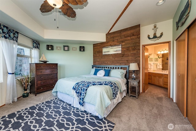 1573 Doe Run Rd, Sequim, WA 98382 - bedroom with wooden walls, a ceiling fan, a closet, light colored carpet, and ensuite bathroom