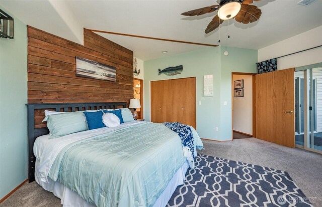 1573 Doe Run Rd, Sequim, WA 98382 - carpeted bedroom featuring visible vents, wood walls, baseboards, and ceiling fan