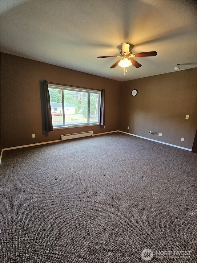 8 Calder Rd, Elma, WA 98541 - carpeted empty room featuring a baseboard heating unit, a ceiling fan, and baseboards