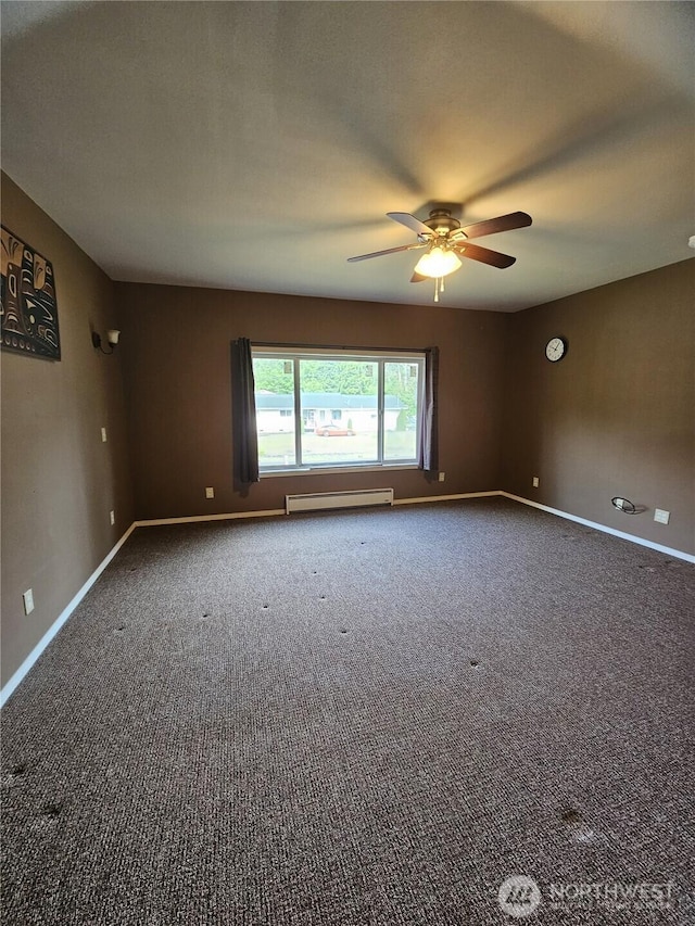 8 Calder Rd, Elma, WA 98541 - empty room with a baseboard heating unit, ceiling fan, carpet, and baseboards