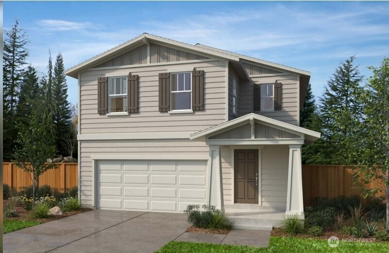 10328 6th Pl SE Unit 19, Lake Stevens, WA 98258 - view of front of house featuring board and batten siding, an attached garage, and driveway