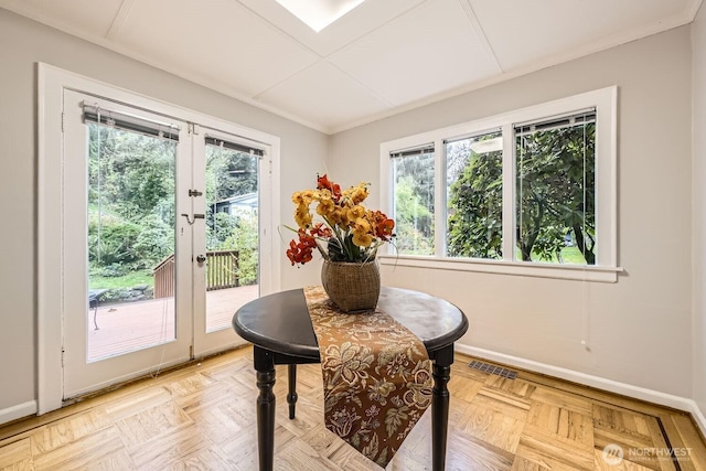 dining area featuring baseboards, visible vents, ornamental molding, and french doors