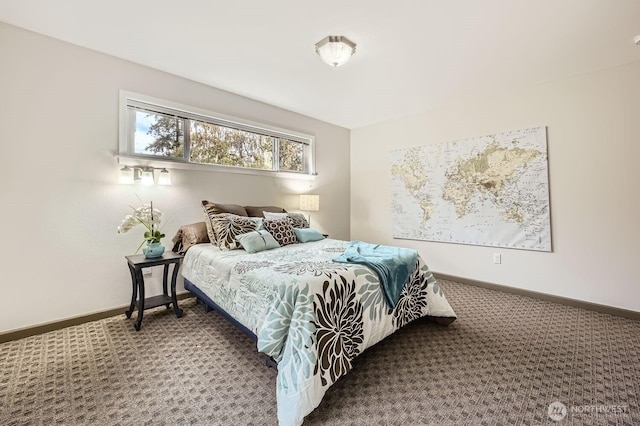 carpeted bedroom featuring baseboards