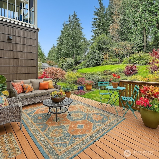 wooden terrace with an outdoor hangout area