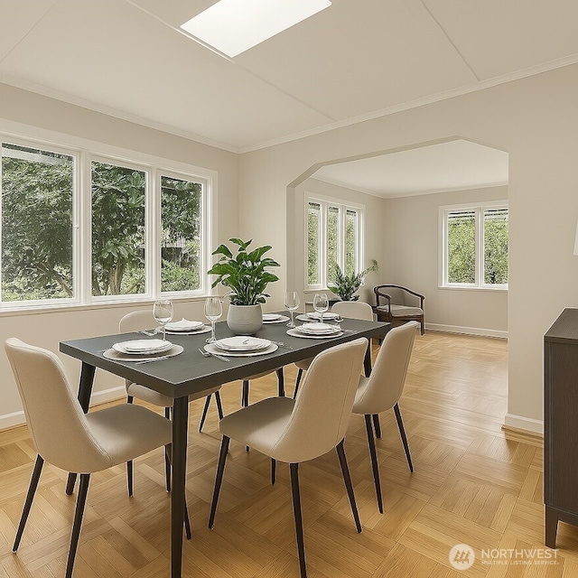 dining area with baseboards and ornamental molding