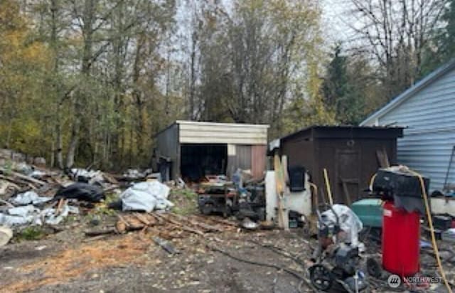 exterior space with a storage unit and an outdoor structure