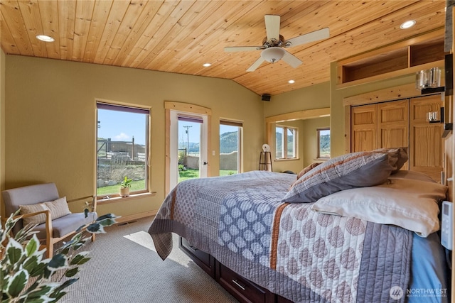 carpeted bedroom with access to outside, multiple windows, recessed lighting, and lofted ceiling