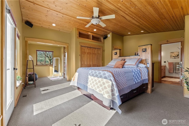 carpeted bedroom featuring a closet, recessed lighting, and wood ceiling
