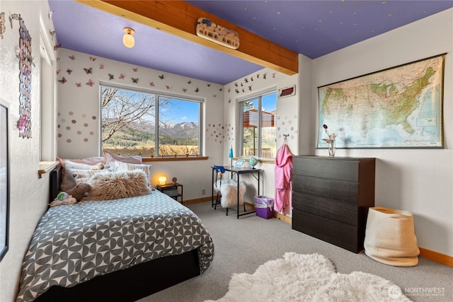 bedroom with baseboards and carpet