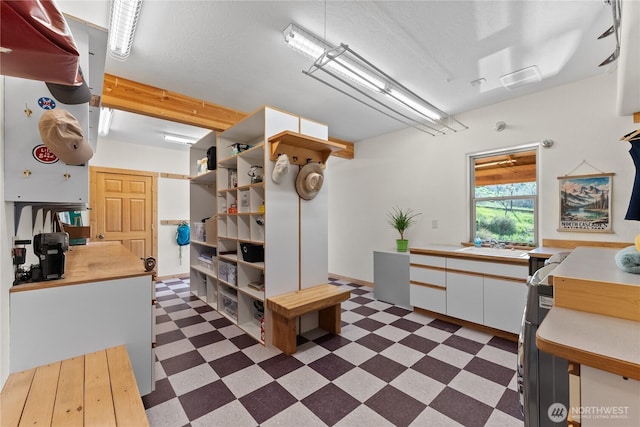 interior space with a sink and dark floors