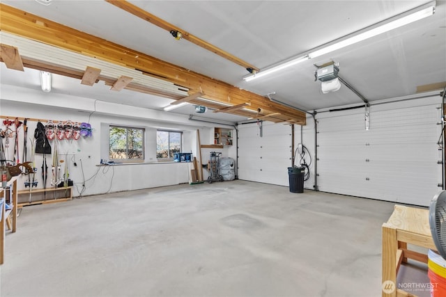 garage featuring a garage door opener