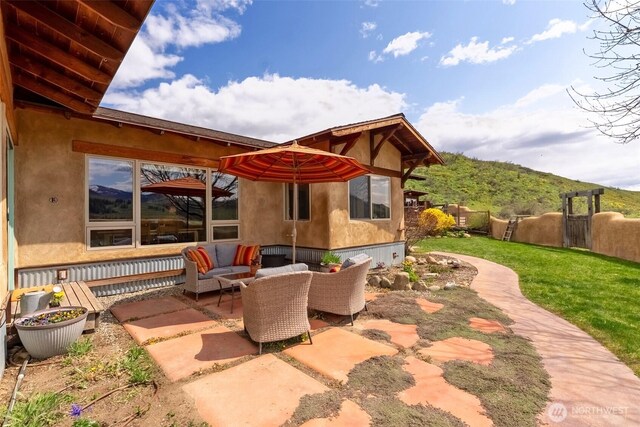 view of patio / terrace featuring fence and an outdoor living space