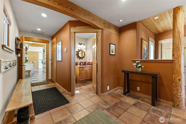 hallway with recessed lighting, baseboards, and visible vents