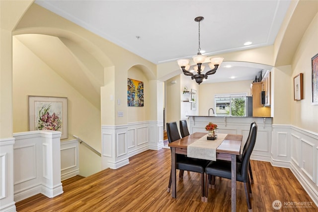 17813 80th Ave NE Unit D5, Kenmore, WA 98028 - dining space featuring a decorative wall, wood finished floors, a wainscoted wall, a notable chandelier, and recessed lighting