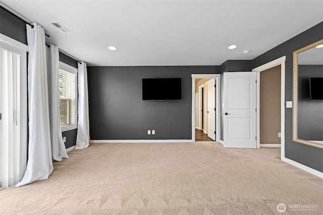 unfurnished bedroom featuring recessed lighting, baseboards, visible vents, and carpet