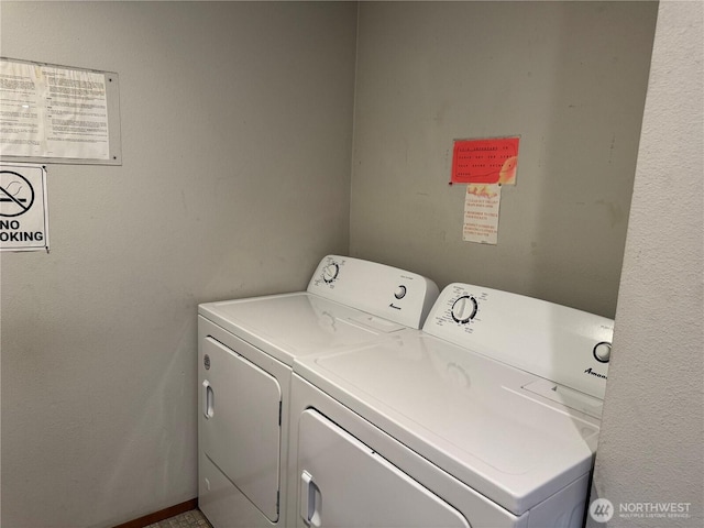 clothes washing area with washer and dryer