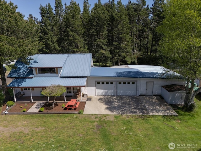 1506 163rd Pl, Long Beach, WA 98631 - view of front of house with a garage, a front yard, driveway, and covered porch
