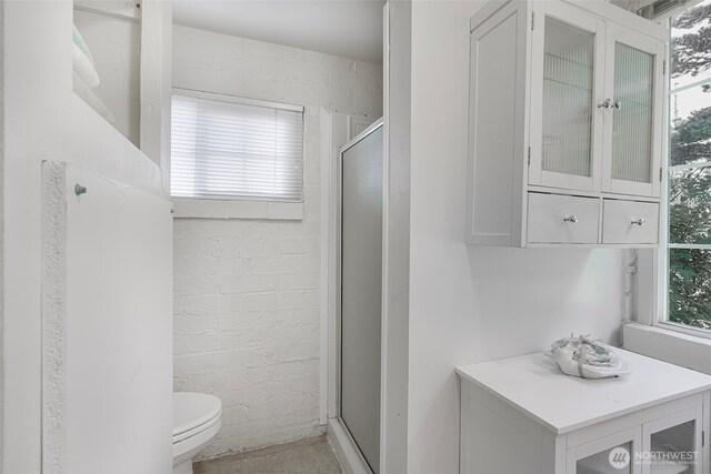 1506 163rd Pl, Long Beach, WA 98631 - full bath with a stall shower, toilet, and a wealth of natural light