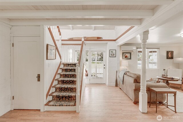 1506 163rd Pl, Long Beach, WA 98631 - stairway with ornamental molding, beamed ceiling, ornate columns, and wood finished floors
