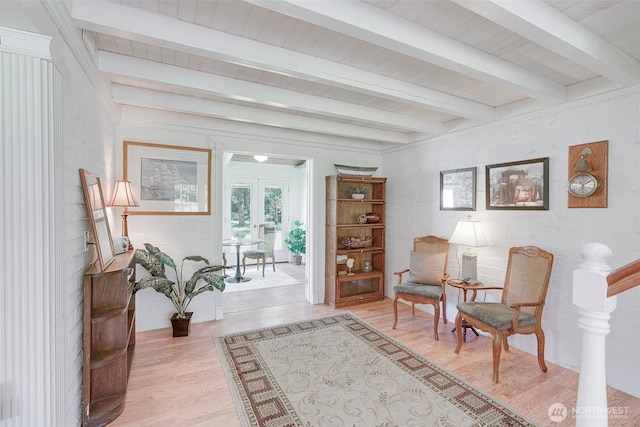 1506 163rd Pl, Long Beach, WA 98631 - sitting room with beamed ceiling, french doors, a healthy amount of sunlight, and light wood-style floors