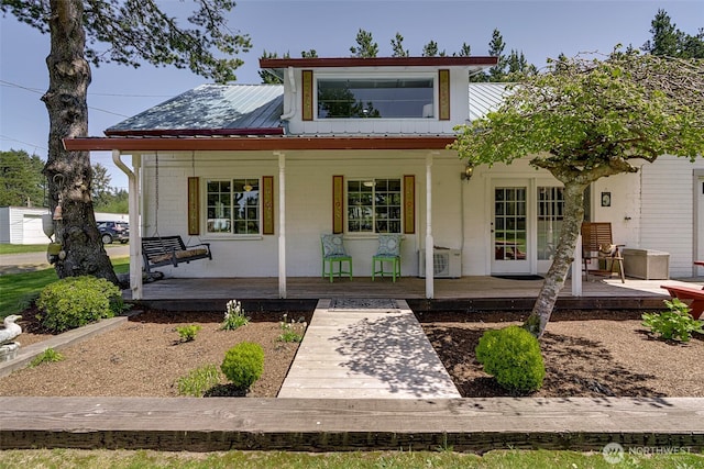 1506 163rd Pl, Long Beach, WA 98631 - back of house with covered porch, metal roof, central AC, and brick siding
