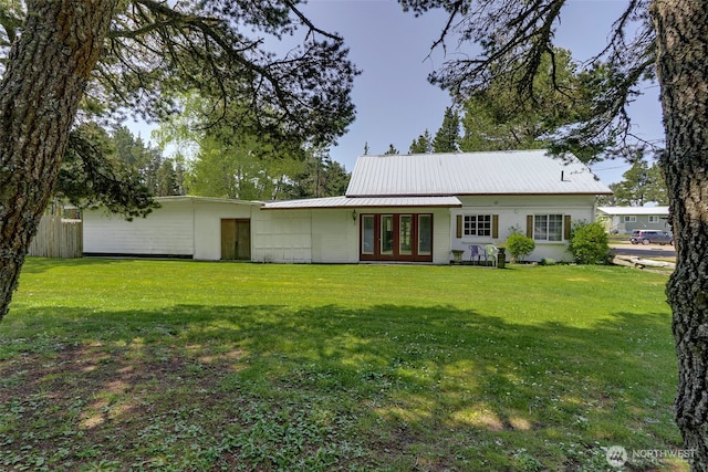 1506 163rd Pl, Long Beach, WA 98631 - rear view of house featuring a lawn, metal roof, and french doors