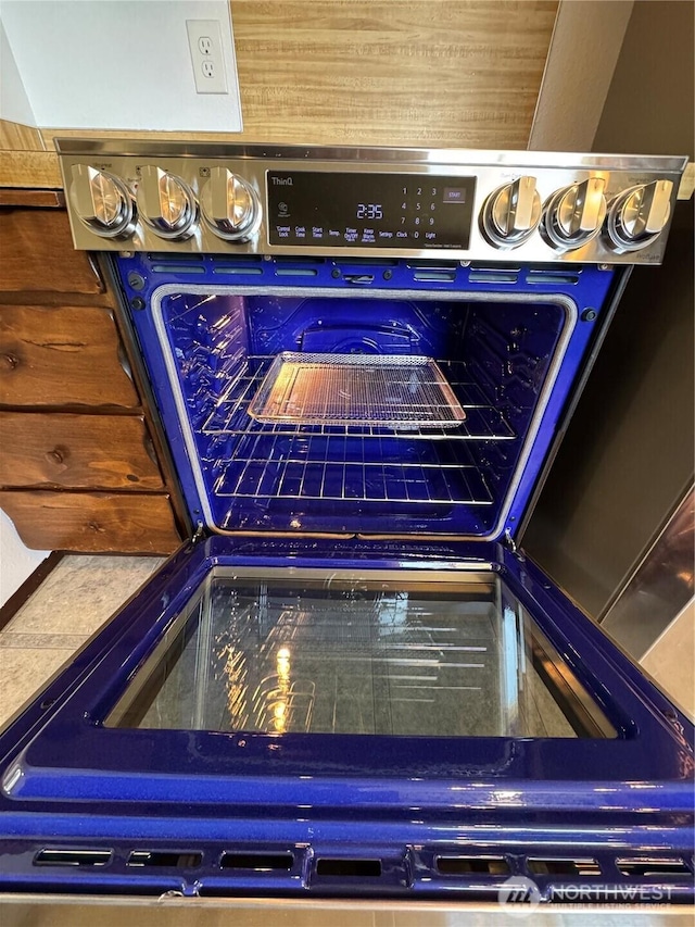details featuring stainless steel range with electric stovetop