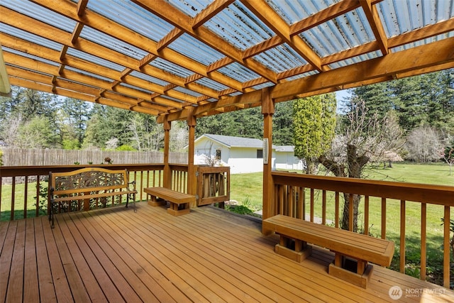 wooden deck featuring fence, a pergola, and a yard