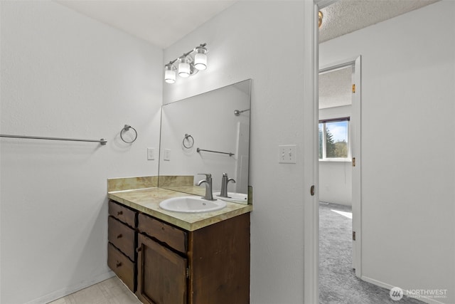 bathroom featuring vanity and baseboards