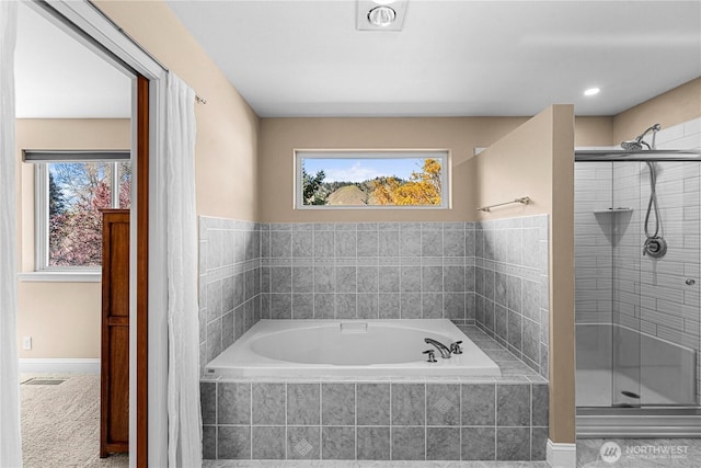 full bath with a shower stall, a bath, and visible vents
