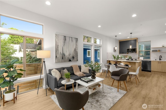 living room featuring recessed lighting and light wood finished floors