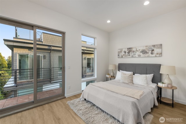 bedroom featuring wood finished floors, access to outside, recessed lighting, and baseboards