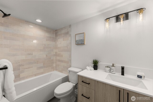 full bath with toilet, washtub / shower combination, and vanity
