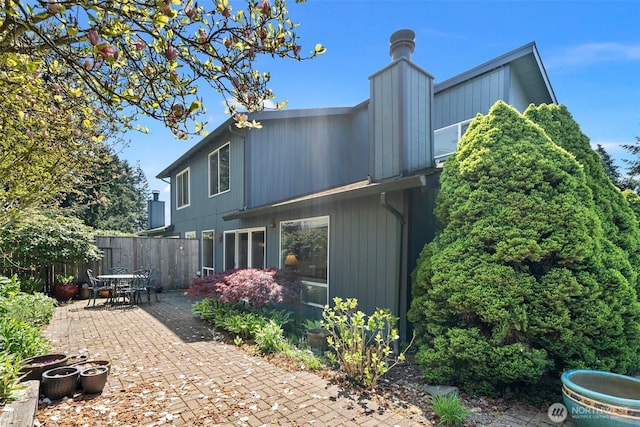 1123 N Whitman, Tacoma, WA 98406 - back of house featuring fence, outdoor dining space, and a patio area