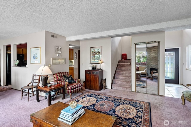 1123 N Whitman, Tacoma, WA 98406 - living room featuring visible vents, stairs, a textured ceiling, and carpet