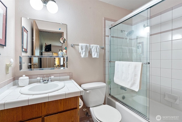 1123 N Whitman, Tacoma, WA 98406 - full bathroom featuring vanity, toilet, a textured wall, and shower / bath combination with glass door